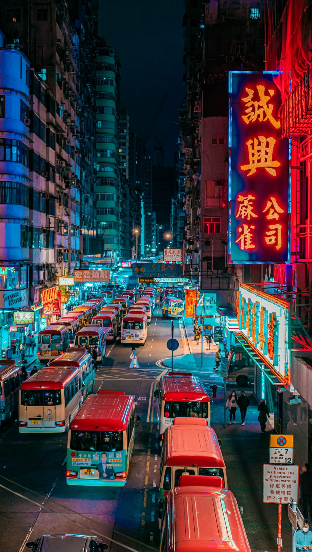 red bus on road during night time