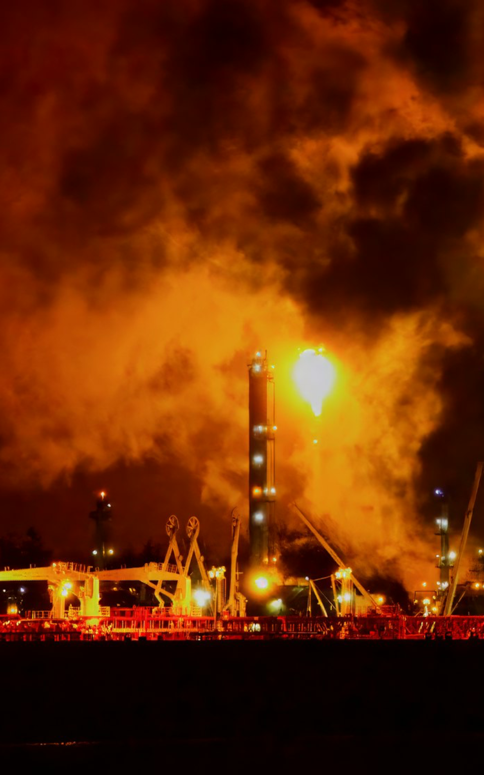 a large factory with a lot of smoke coming out of it